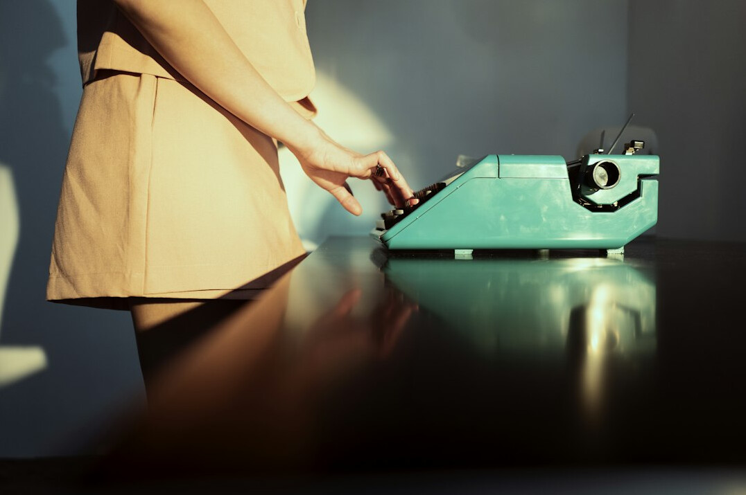 mystery writer at typewriter